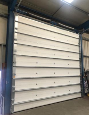 Exportadores de puertas seccionales industriales de estación de bomberos con cerradura de alta seguridad, formadas automáticamente y de emergencia, y puertas enrollables ignífugas