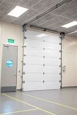 Tamaño modificado para requisitos particulares industrial de la puerta seccional clasificada del fuego de elevación de Warehouse