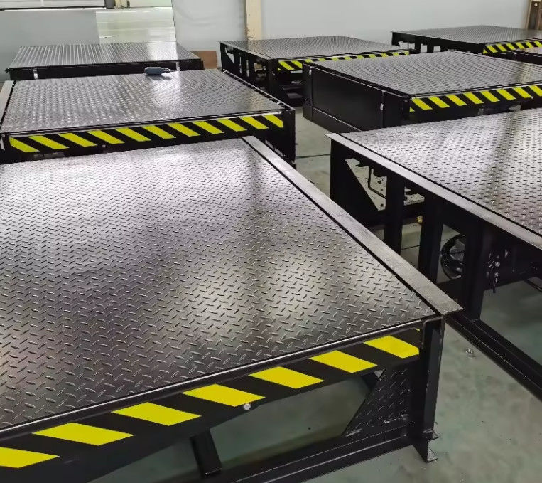Nivelador de muelle eléctrico personalizable con características de seguridad en el sitio Instalación de controles con botón de presión